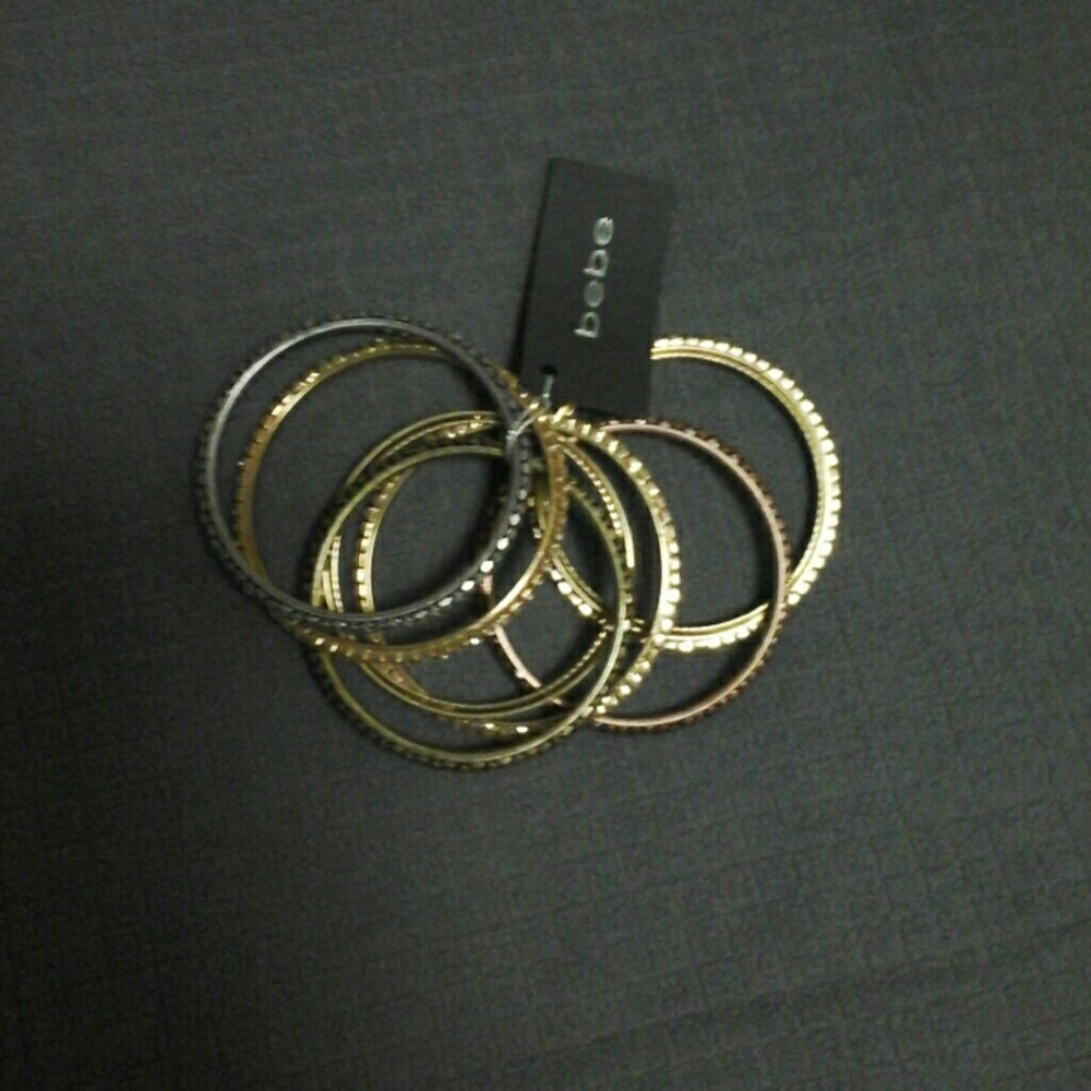BEBÉ SNAKE STYLE AND RHINESTONE BRACELETS .
